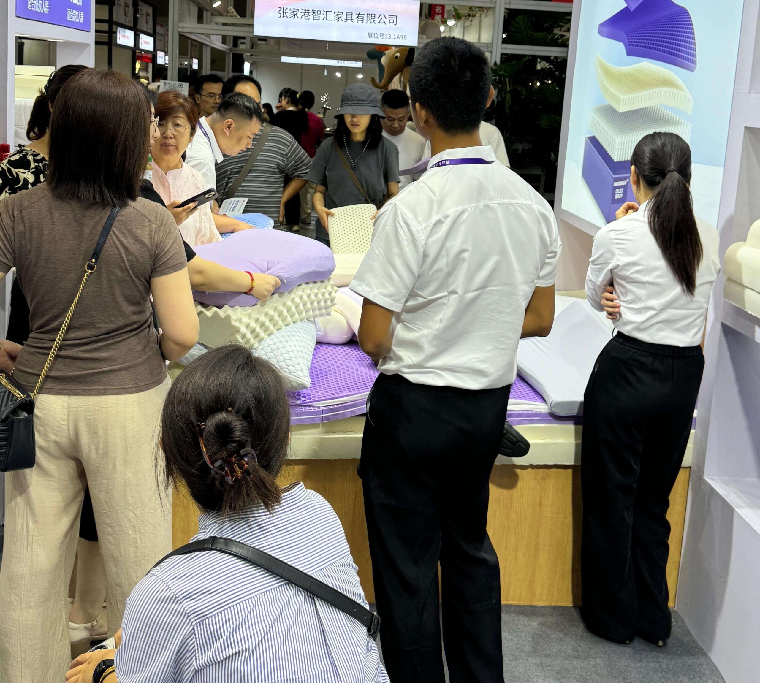 Shanghai exhibition booth with customers viewing pillow