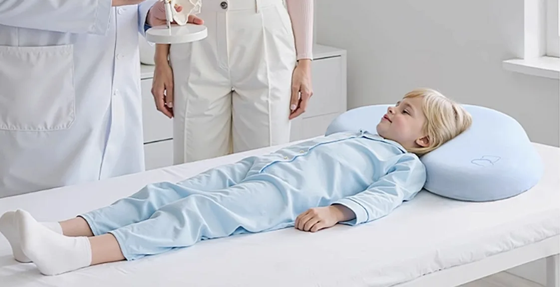 Child lying on a medical mattress for spine support